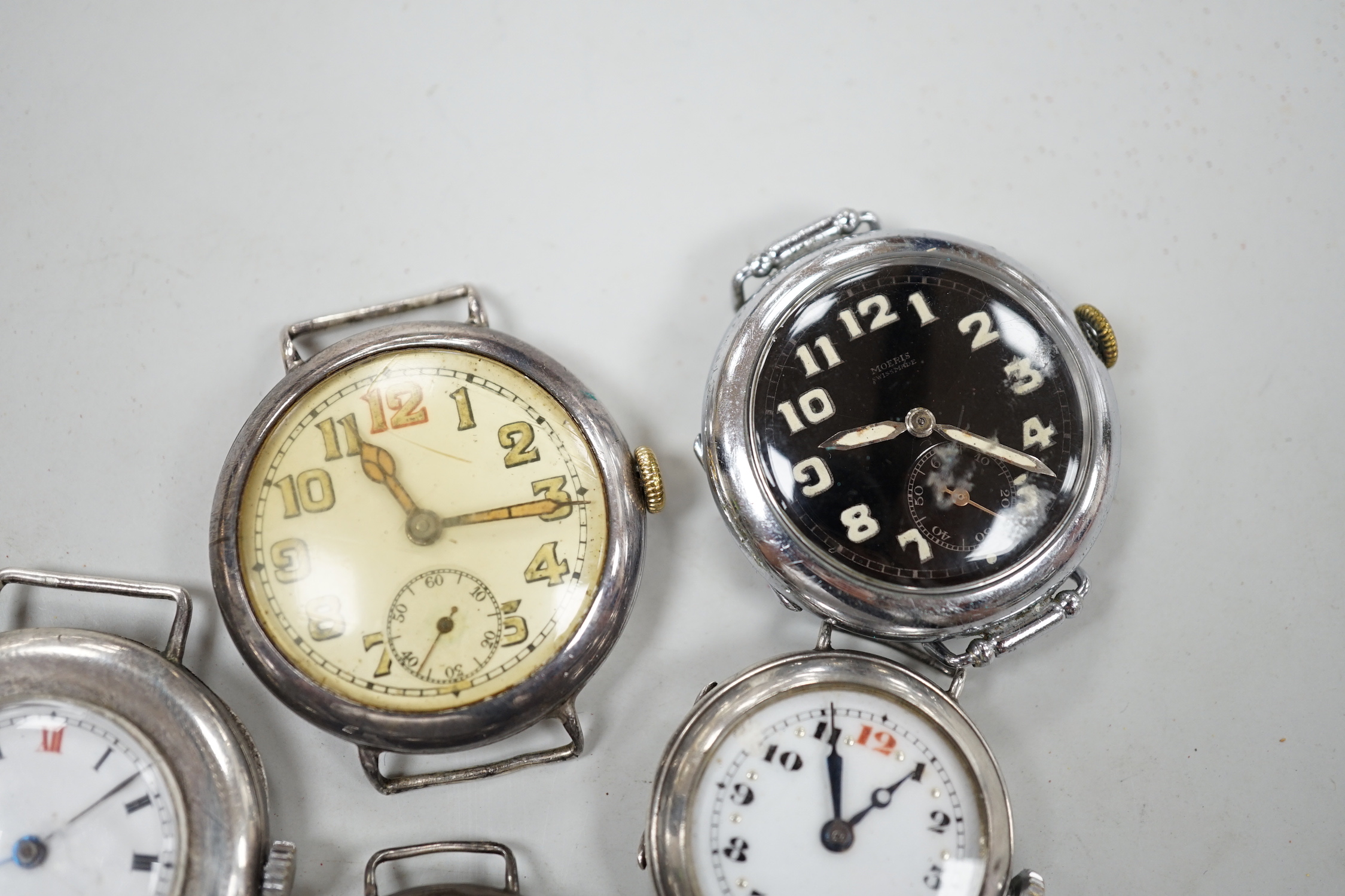 A gentleman's early 20th century 9ct gold manual wind wrist watch and six other wrist watches including silver.